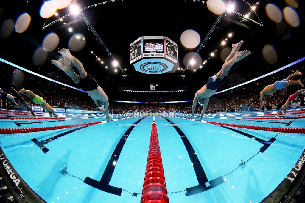 OMAHA, NE - JUNE 30: (L-R) Davis Tarwater and Michael Phelps dive off of the starting block at the start of the second semifinal heat of the Men's 100 m Butterfly during Day Six of the 2012 U.S. Olympic Swimming Team Trials at CenturyLink Center on June 30, 2012 in Omaha, Nebraska. (Photo by Al Bello/Getty Images) *** Local Caption *** Davis Tarwater; Michael Phelps